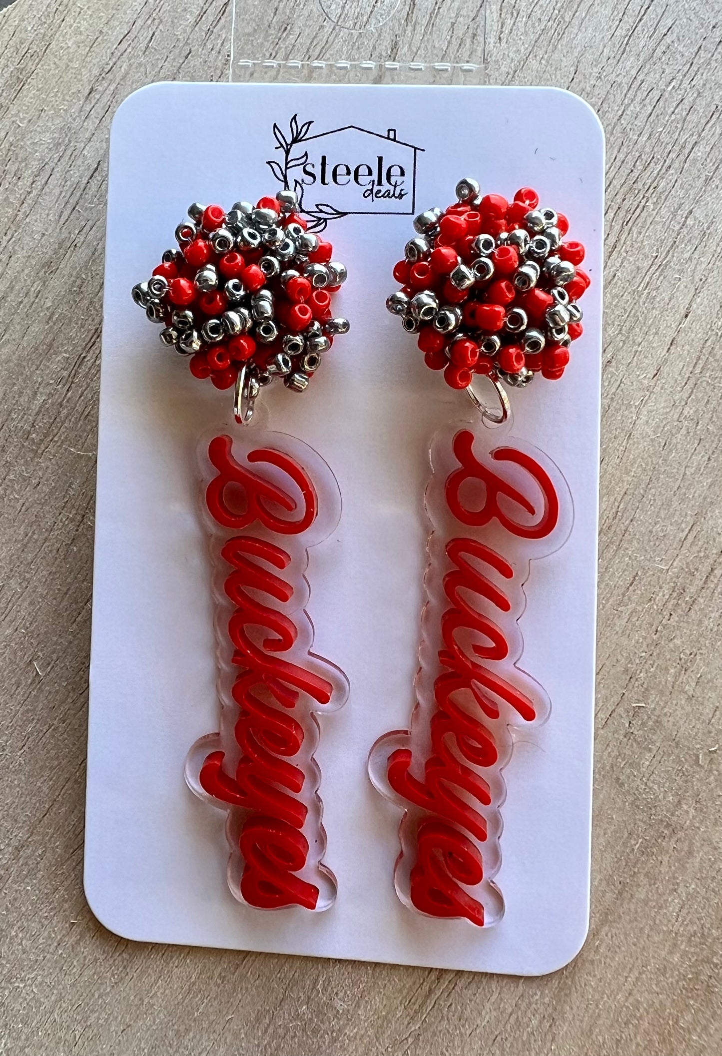 red and silver beaded top with football team name hanging below made from acrylic