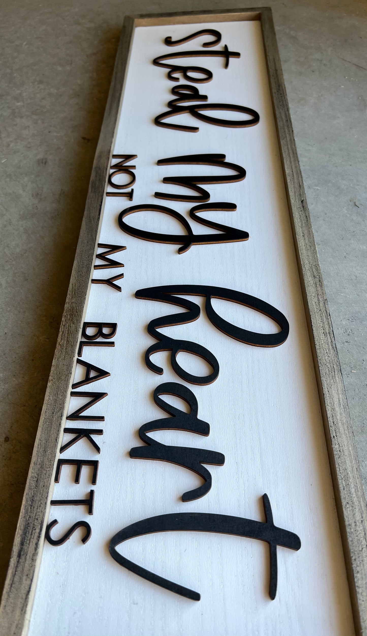 wooden sign with the quote "steal my heart not my blankets"