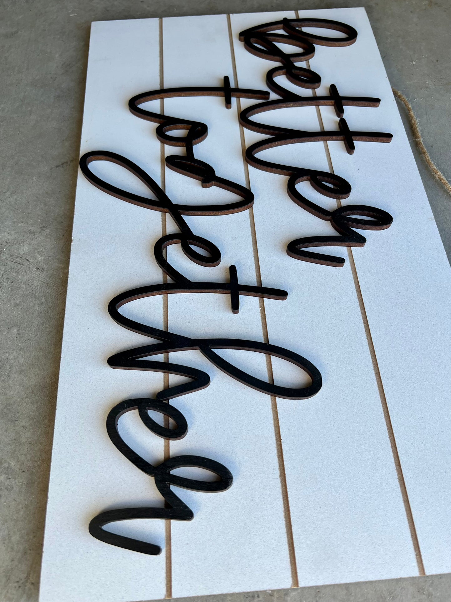 Phrase "Better together" on a shiplap wooden sign