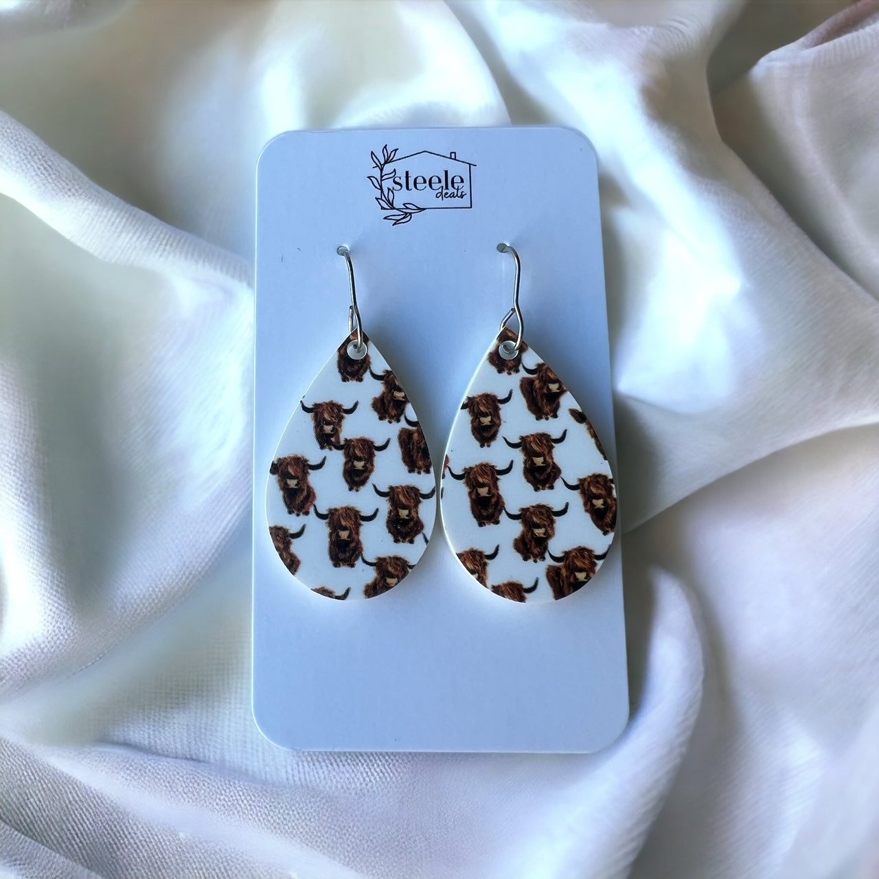 acrylic teardrop dangle earrings with the print of highland cows