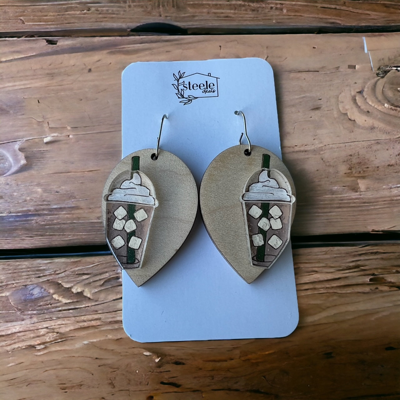 teardrop dangle earrings with a wood base and acrylic iced coffee design on top