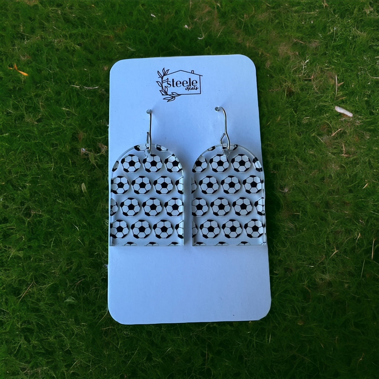 soccer pattern on arched dangle earrings