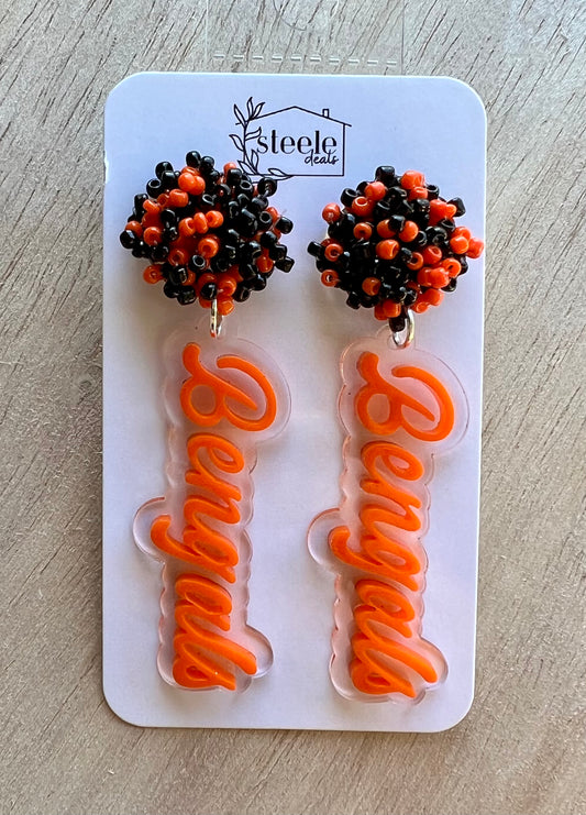 orange and black beaded earrings with layered acrylic football team dangled