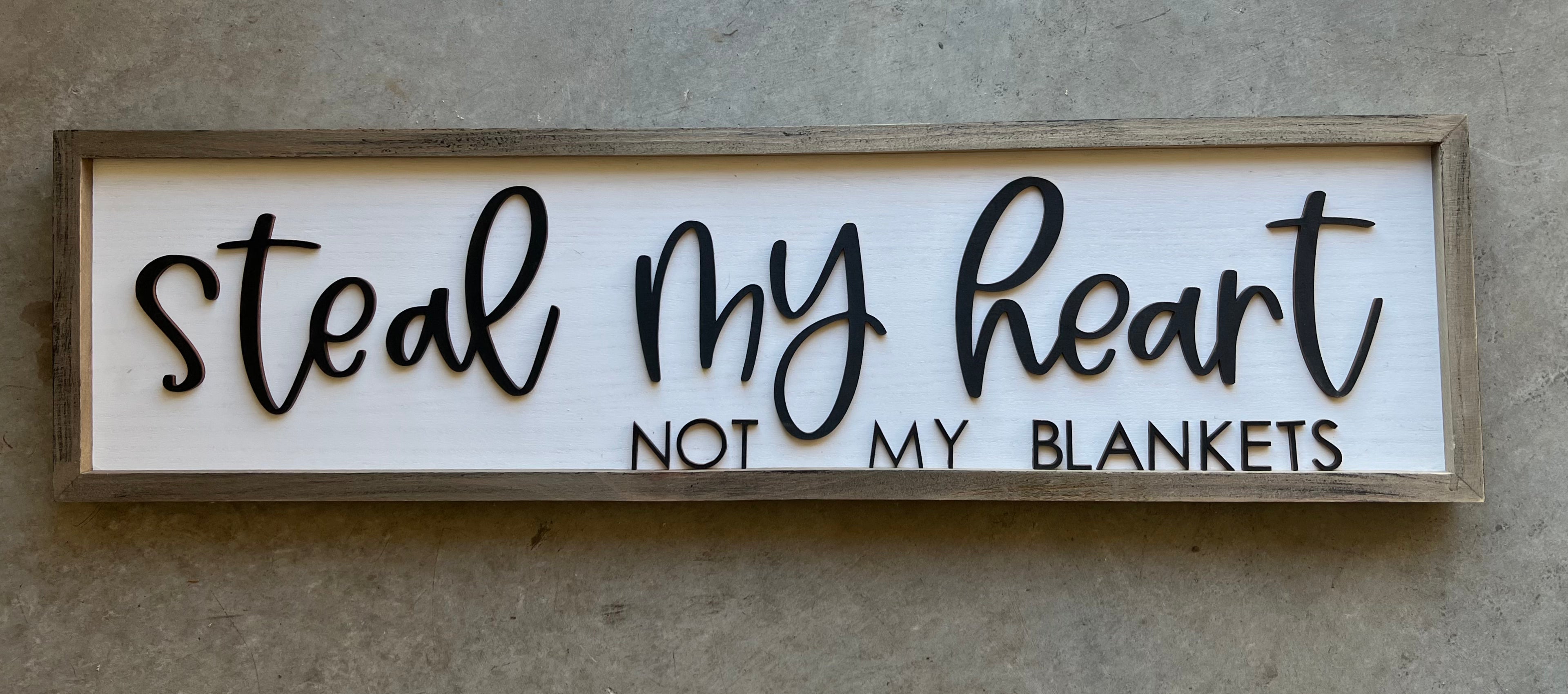 wooden sign with the quote "steal my heart not my blankets"