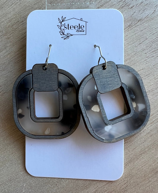 inlay dangle earrings made from gray wood and acrylic