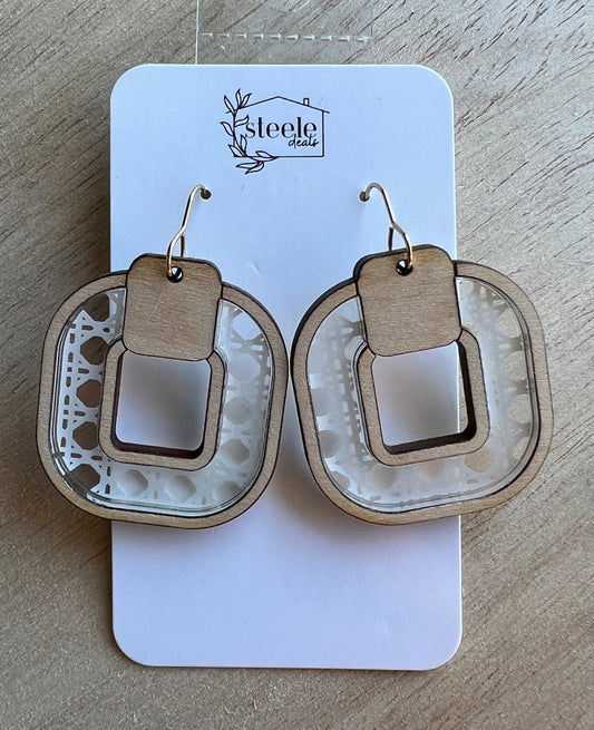dangle earrings with a wooden outer and inner layer and acrylic rattan inlay in the center