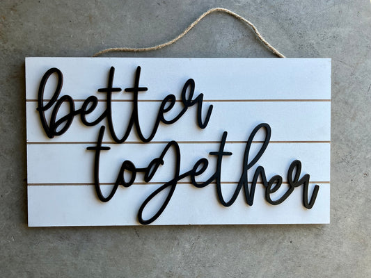 Phrase "Better together" on a shiplap wooden sign