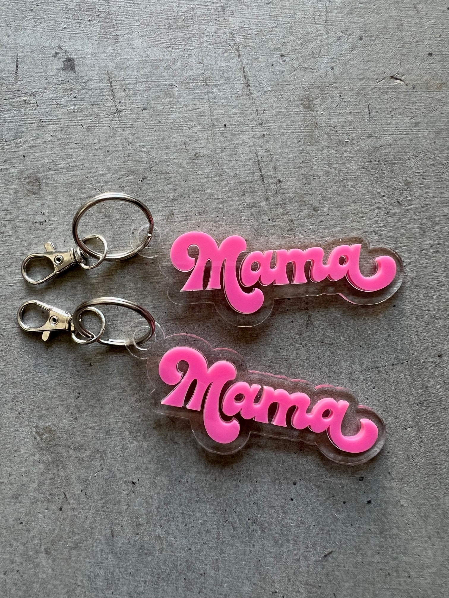 Two layer acrylic keychain with the design of MAMA