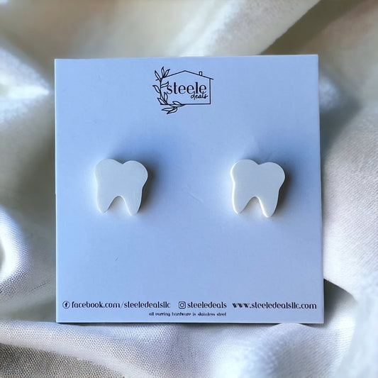 acrylic stud earrings in the shape and color of a white tooth