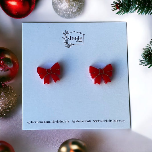 acrylic stud earrings in the shape and color of a red bow