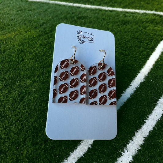 football pattern on arched dangle earrings  Edit alt text