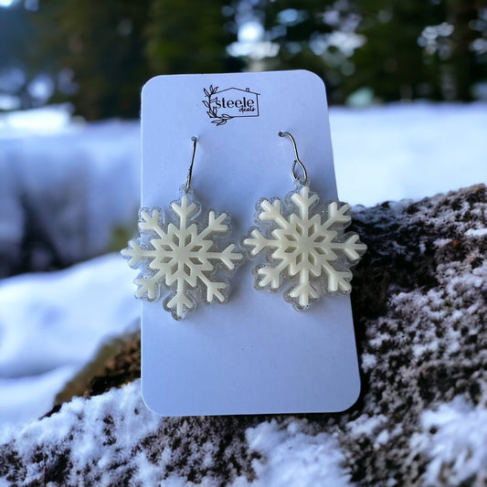acrylic dangle earrings in the shape of a snowflake