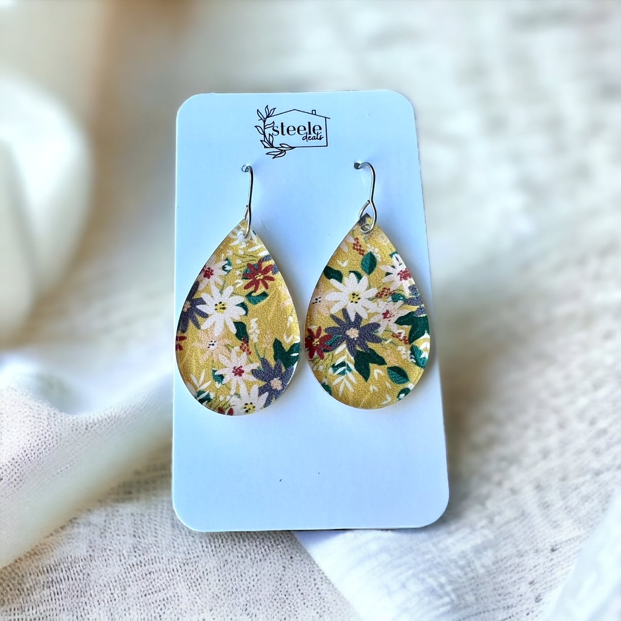 acrylic teardrop dangle earrings with a yellow floral pattern
