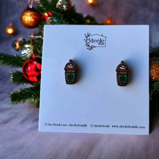 wood stud earrings in the shape of frozen coffee with a green sleeve and snowflake in the center