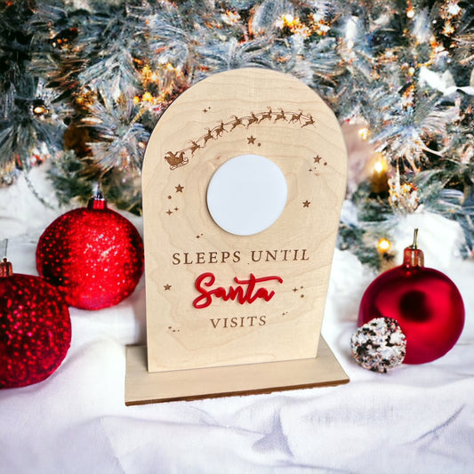 arched wooden sign with circle dry erase board in center to keep track of how many sleeps until Santa visits